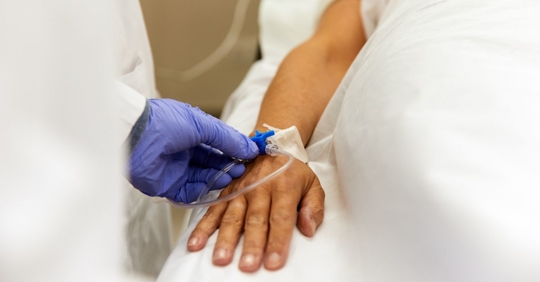 Doctor with Gloves inserting IV